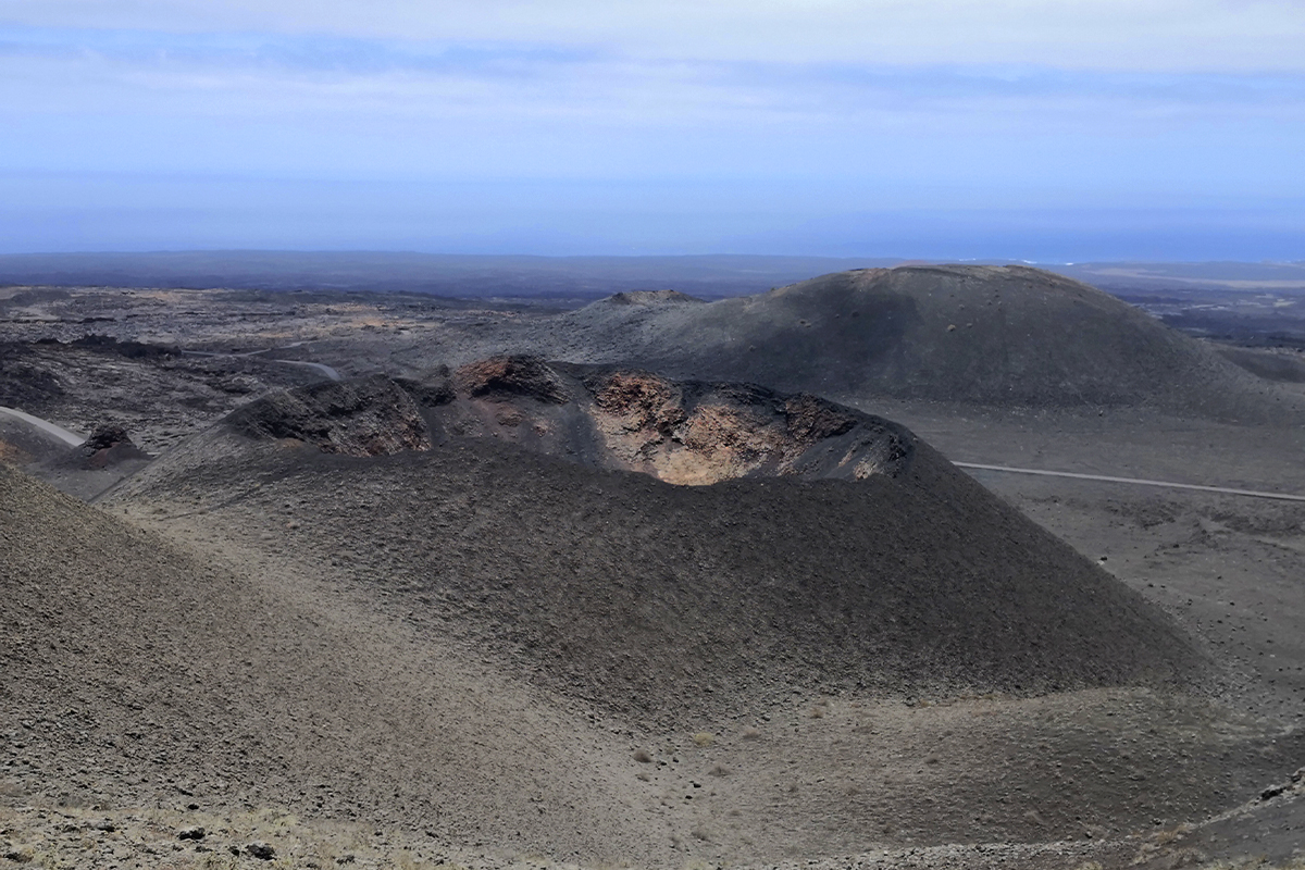 gray volcanic caldera in timanfaya - Yaizart