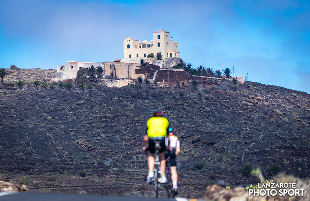 Cyclists climbing Corona volcano
