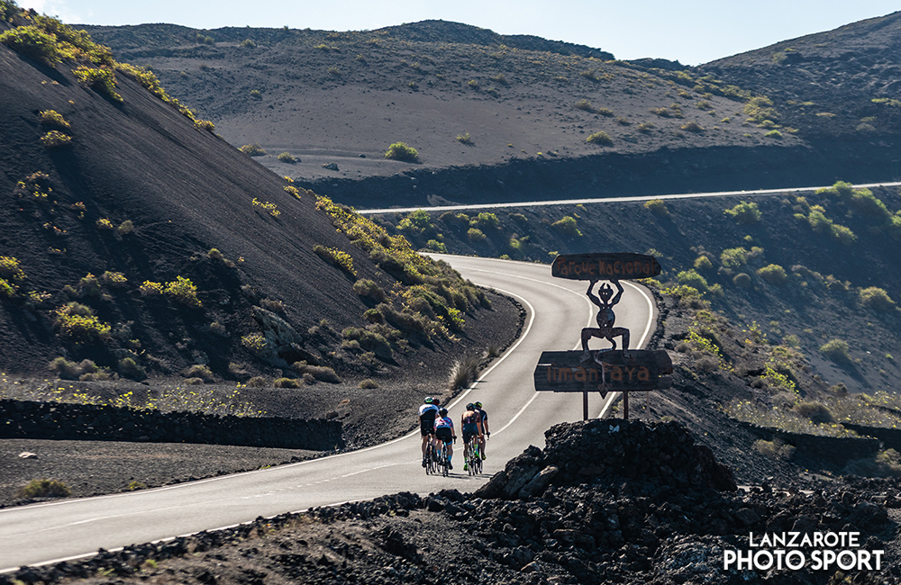 Cyclist platoon on the Timanfaya road