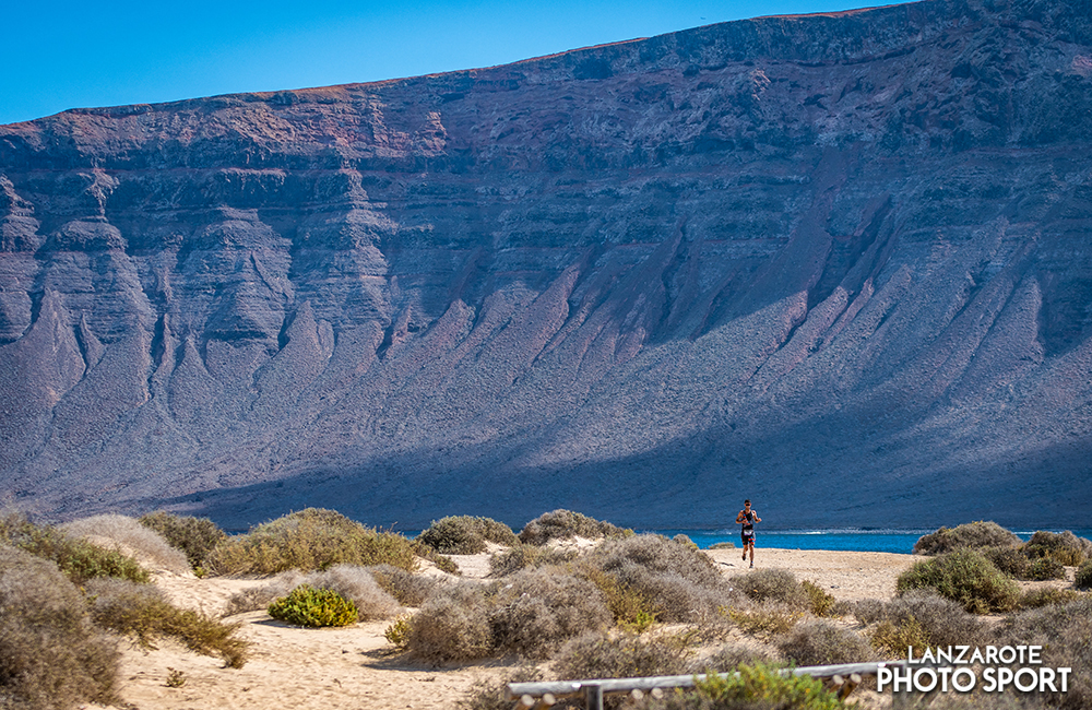 Running with views of Famara in the 8th Island challenge