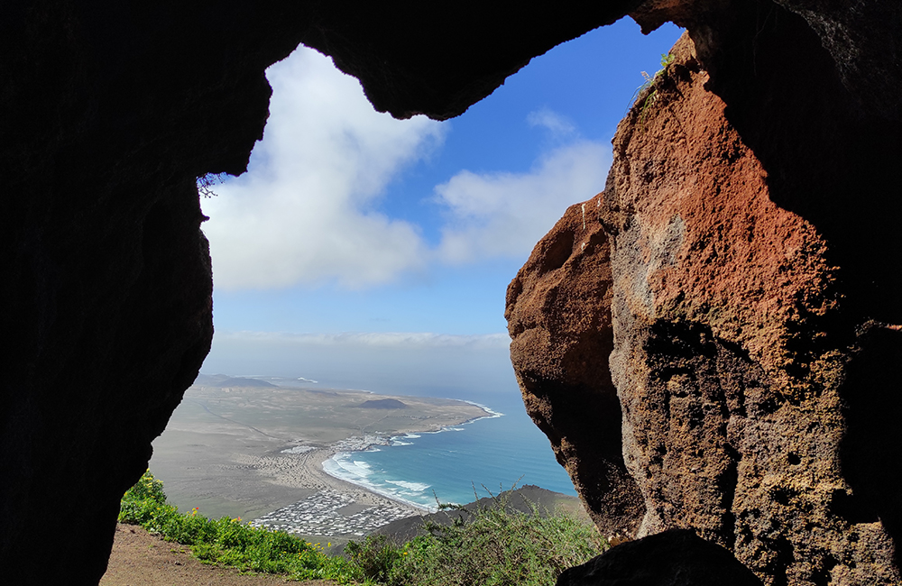 Views to Famara from cliff caves